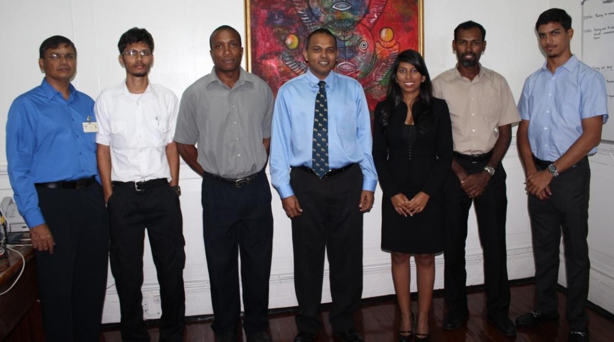 Picture from left to right, Dr. Bhiro Harry, Mr. Roul Bhudu, Mr. Michael Blake, Honourable Minister Dr. Anthony, Ms. Vidushi Persaud, Mr. Ryan McKinnon and Mr. Pravesh Harry